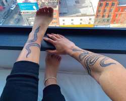 She and her boyfriend have a snake tattoo. Her tattoo is on her left leg whereas his tattoo is on his right hand.
